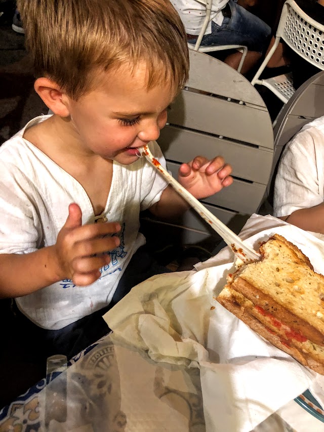 Ollie eating his Bruchietta at Bruchietta restaurant in Arbori